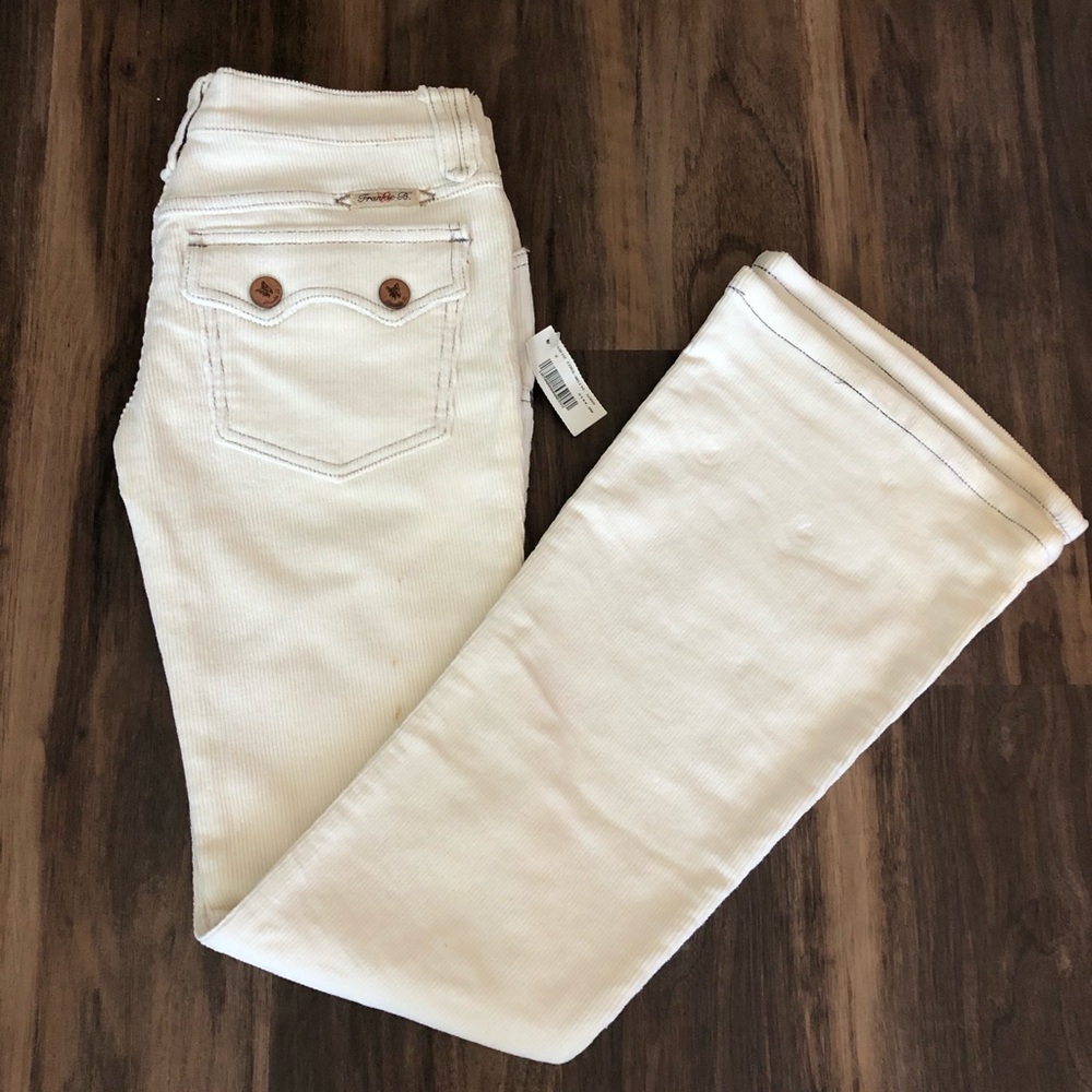 Frankie B white corduroy flare pants.